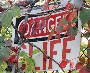 Danger Cliff” sign is located near Fishing creek where Justin King , a first year student at Bloomsburg, was found deceased on the morning of Sept. 14. 