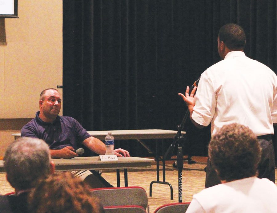 Eric Bower listens to a student at the Talk of the Town Hall Forum on Oct. 22