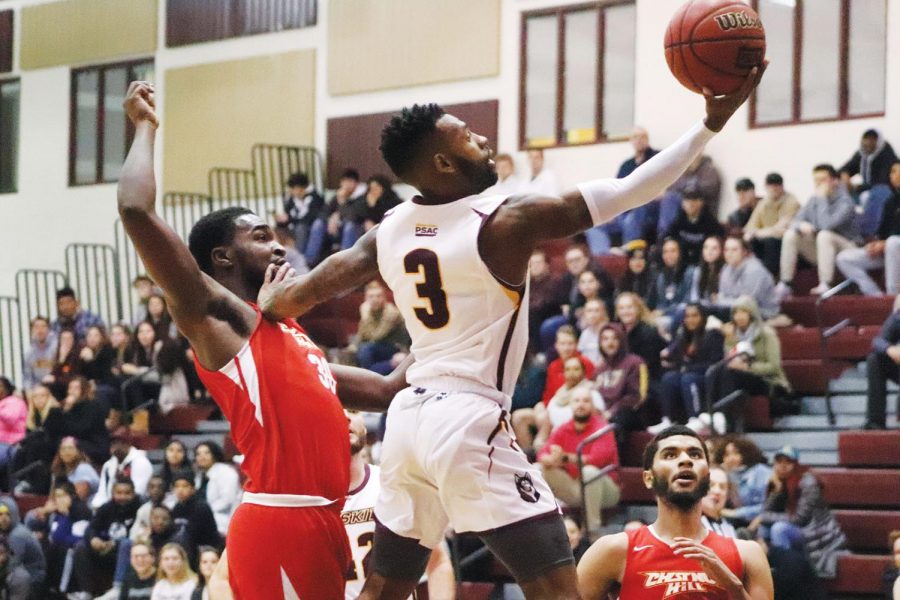 No. 3 Ky Mauras leaps past a Chestnut Hill defender for an open layup.