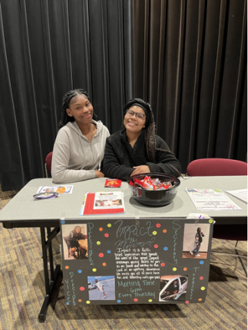 Members of Impact, Adriana Glasgow (left) and Scripture House (right), advertised their club at the club fair hosted in Kehr Union Ballroom. Photo by Novalea Verno. 