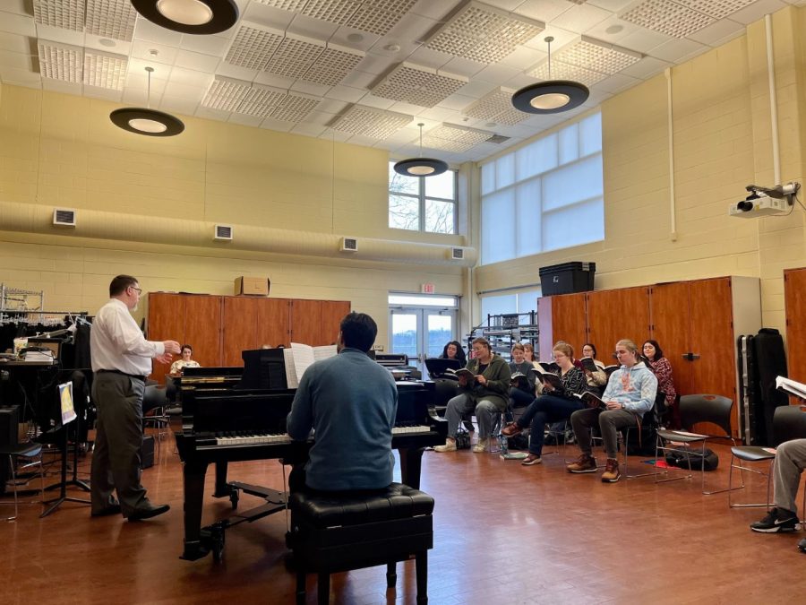 Singers engaged in rehearsal with instructor. Photo by Novalea Verno. 