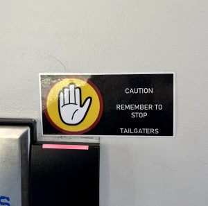 A sign in Elwell Hall stresses the importance of not letting tailgating happen.