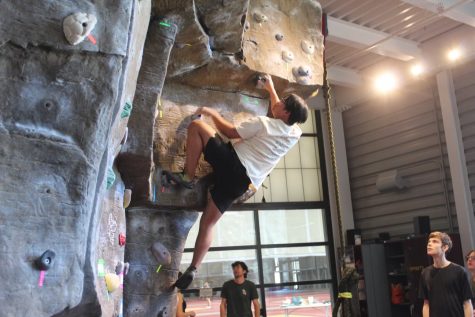 A Bucknell University student attempts to climb a V4. Photo by Nick McCormack.