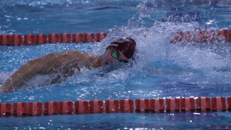 Andy Thomas swims the 100-freestyle. Photo via Athletic Marketing and Communication.