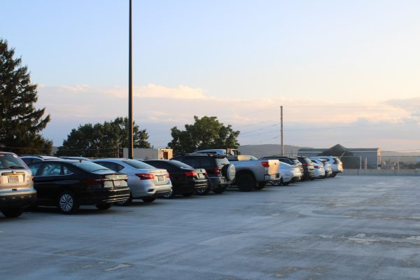A full tri-level parking lot with many students and faculty parked. Photo by Carly Busfield. 