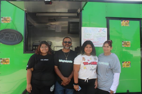 The Valentin family stands proud in front of their new food truck, Big Pappys Empanadas, a current hot spot of Main Street.
