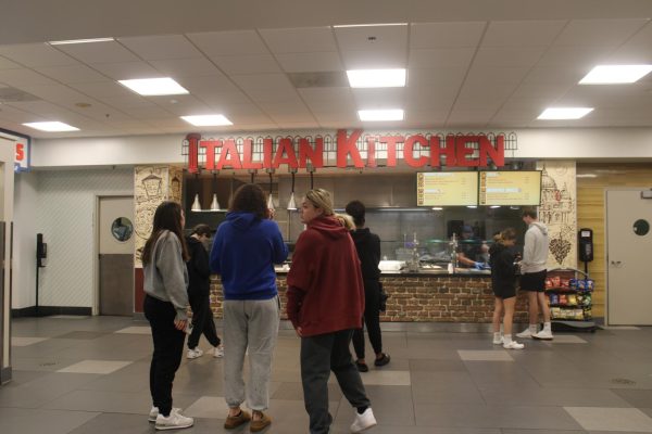 Students wait in line at the Italian Kitchen in the Husky Lounge. 