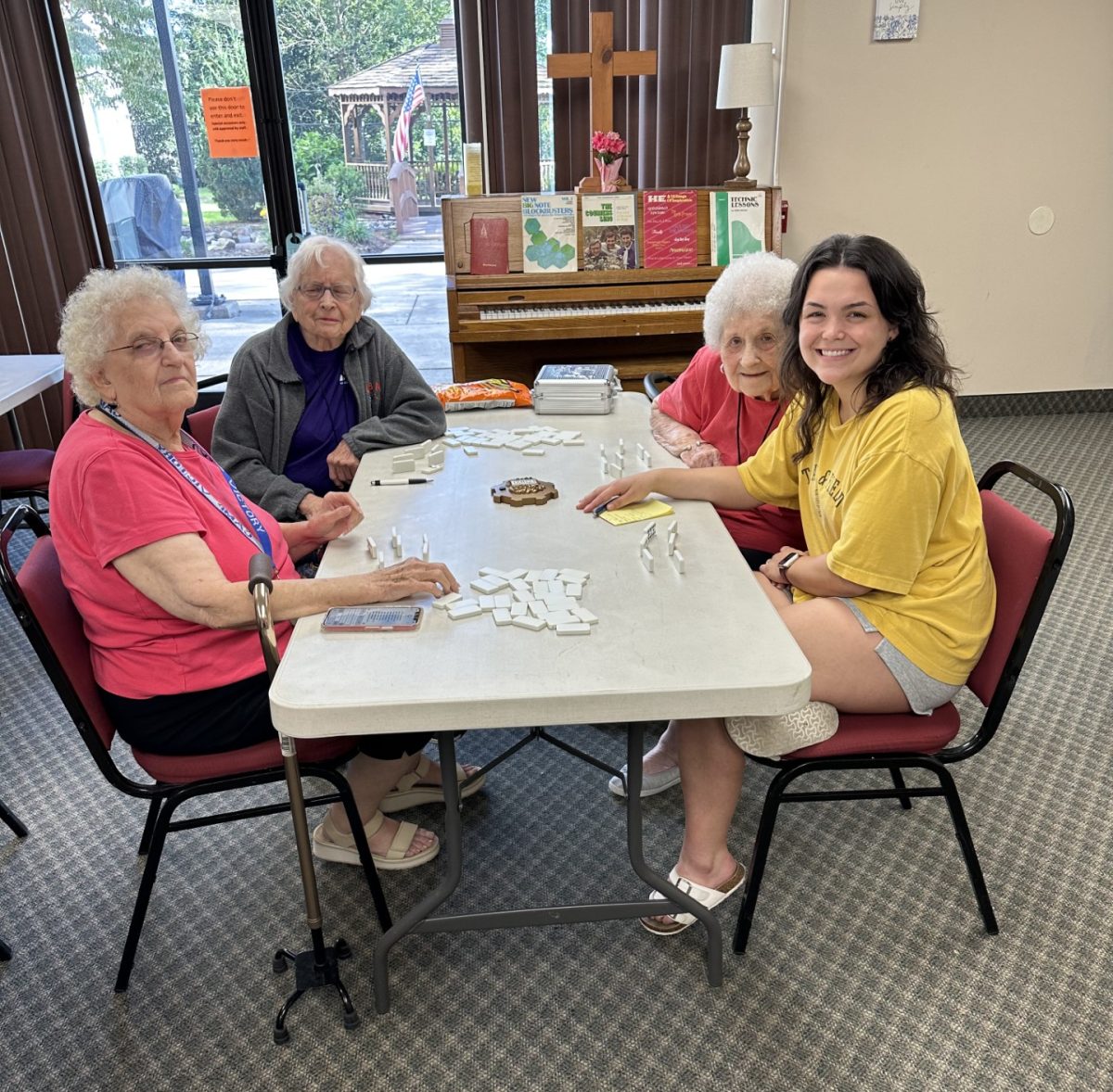 Bloomsburg Towers residents (back to front) Kay Hammaker, Nancy Keller and Arletta Makara hang out with ASIG Vice president Julie MacWilliams. 
