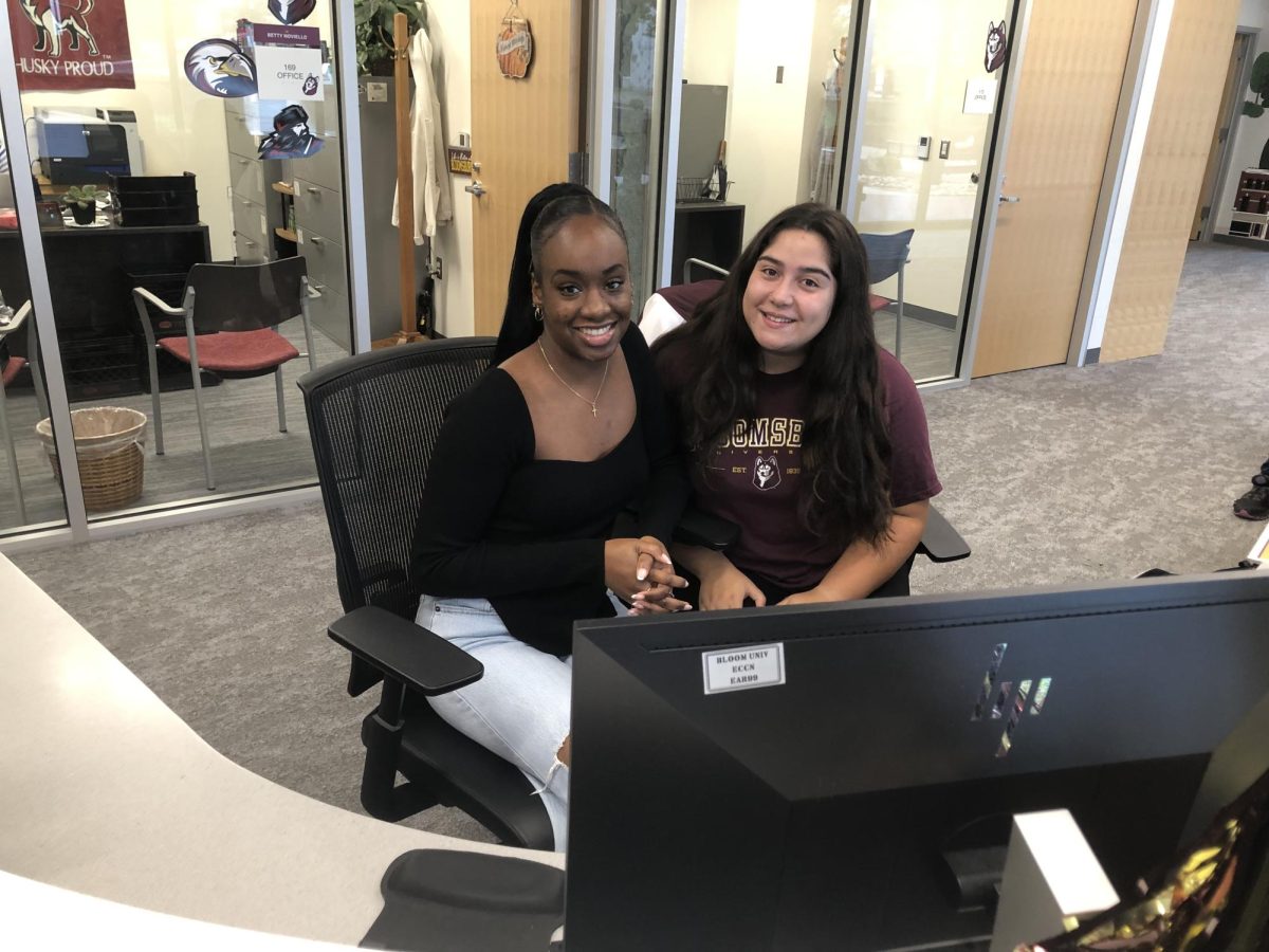 Makayla Miller and Mia Perez working at the Admissions Office in the Arts and Administration building.
