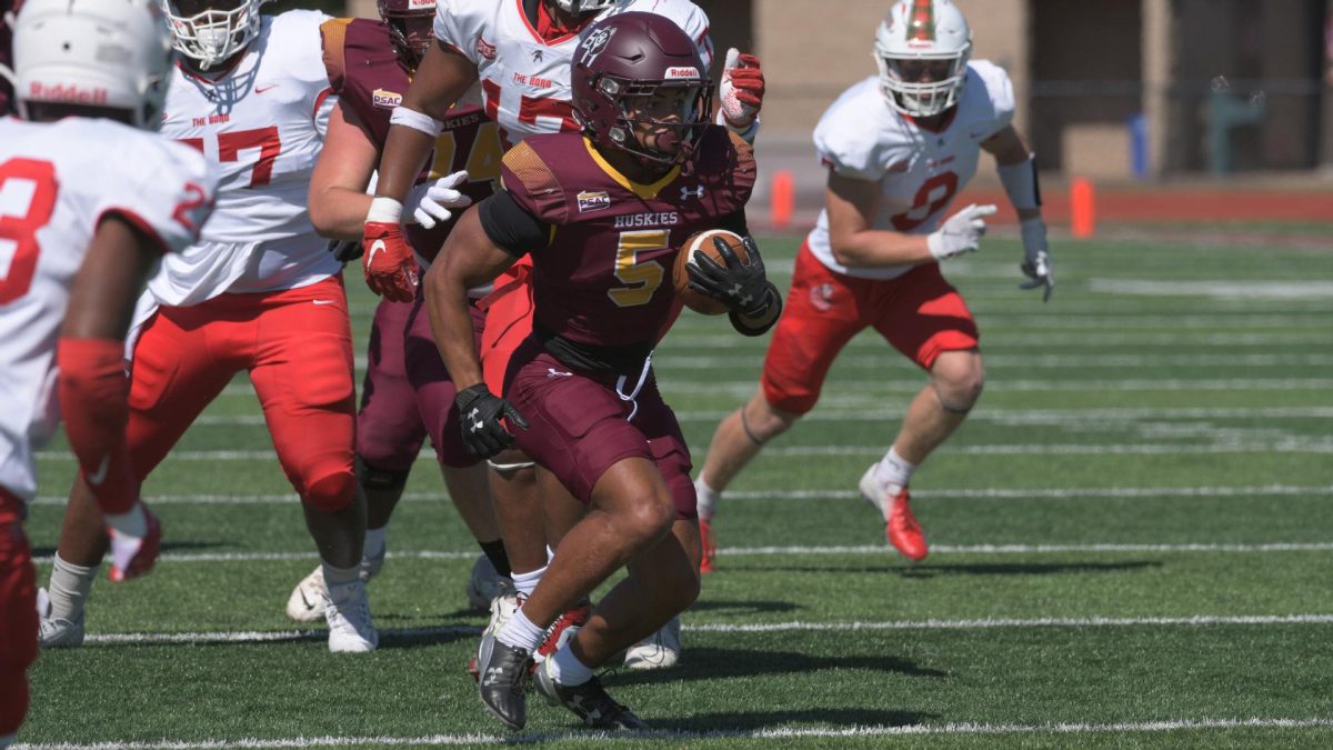 Kaleb Monaco Rushes The Ball. Photo via Athletic Marketing and Communication. 