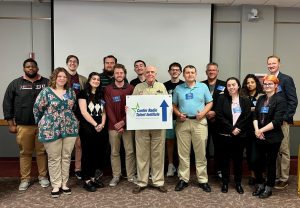 Confer Radio Talent Institute 2023 participants stand with Kerby Confer. 
