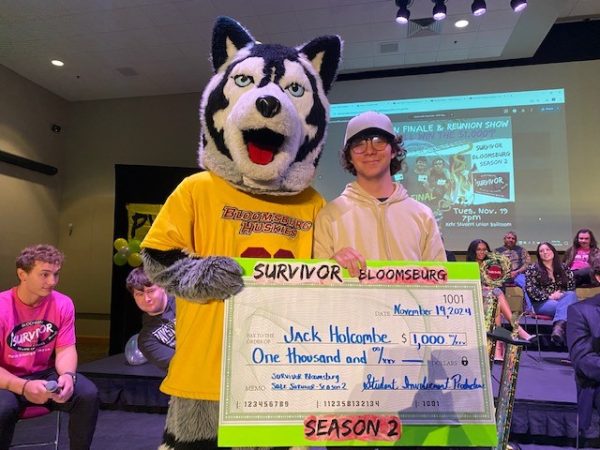 Jack Holcombe presented with the $1,000 check after being voted winner of Season 2. Photo submitted by George Kinzel. 