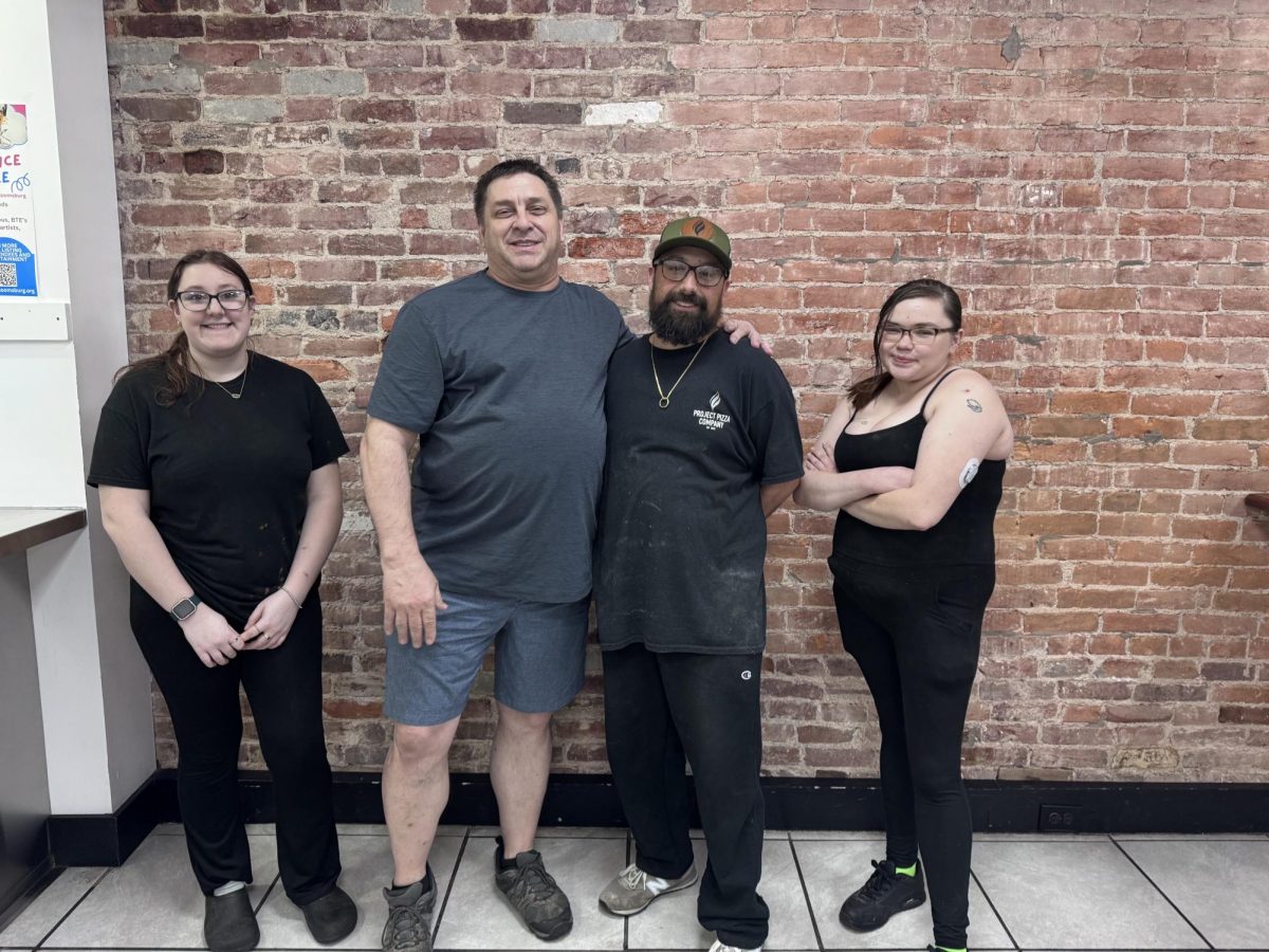 Tri Pi employees, Difebo in grey shirt