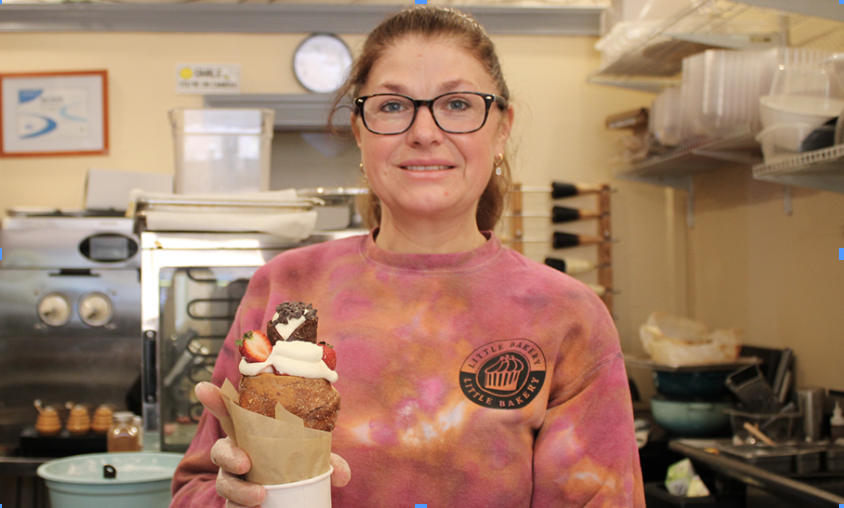 Nataliia Bundziak holding the iconic chimney cake