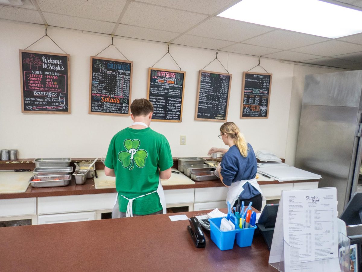 Employees hard at work preparing subs
