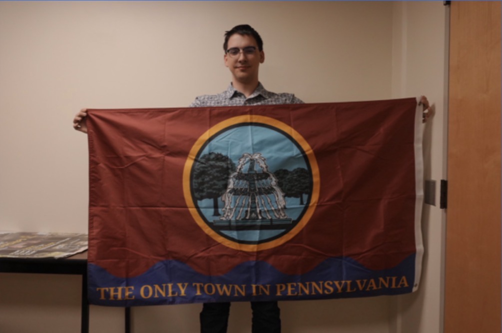 ScreenshotAyden Pointer holding the Bloomsburg town flag he created.

Provided by Ayden Pointer.